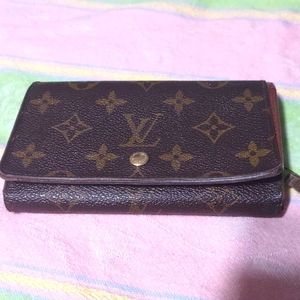 Louis Vuitton monogram compact snap wallet.
